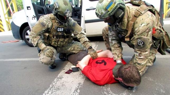 Members of Ukraine's state security service detain a French citizen who had been planning attacks in France to coincide with the Euro 2016 football championship it is hosting, on the Ukrainian-Polish border in Volyn region, Ukraine, in this undated photo released by Ukraine's state security service on June 6, 2016. Ukraine's State Security Service/Handout via REUTERS
