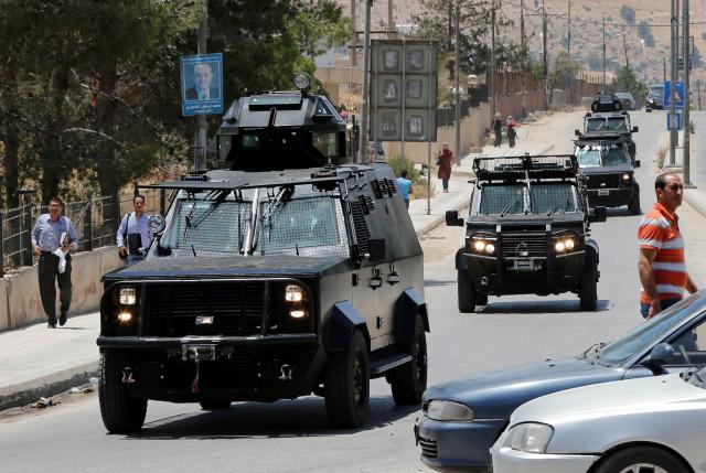 Jordanian security vehicles seen near the General Intelligence directorate offices near al Baqaa Refugee Camp, north of Amman, Jordan, June 6, 2016. REUTERS/Muhammad Hamed